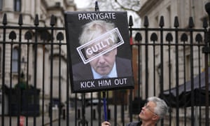 A protester outside Downing Street. Photograph: Frank Augstein/AP