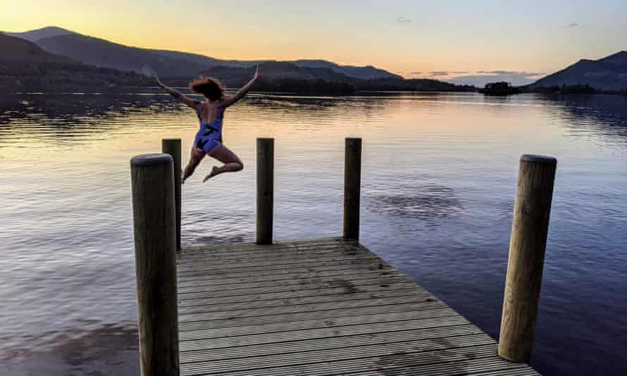 Ali Phillips jumping into a lake