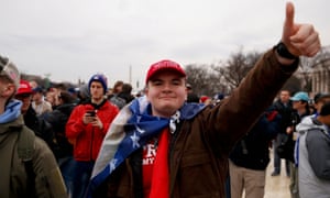 Trump supporters in red hats gather on the National Mall.