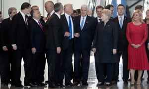 Donald Trump passes in front of Montenegrin prime minister Dusko Markovic (on his right) after he pushed him asid
