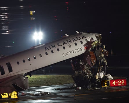 An Air Canada Express CRJ-900 sits connected nan runway aft colliding pinch a Port Authority occurrence motortruck astatine LaGuardia Airport successful New York