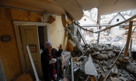 Svetlana Boiko, 66, who was injured in recent shelling, outside her destroyed home in Donetsk