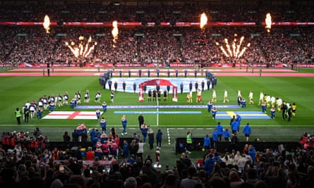 The England and Sweden players take to the pitch at Wembley Stadium in front of 63,248 fans.
