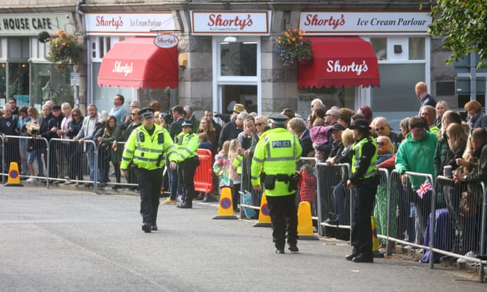 People line the street waiting for the cortege carrying the coffin of Britain’s Queen Elizabeth in Ballater.