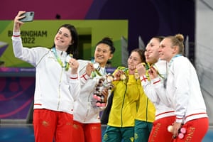 Australia’s women’s synchronised 10m platform diving gold medalists Charli Petrov and Melissa Wu celebrate with silver medalists Andrea Sirieix and Eden Cheng and bronze medalists Robyn Birch and Emily Martin