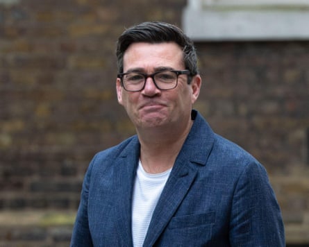 Andy Burnham smiling to a camera outside Downing Street earlier this year