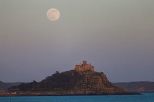 The supermoon rises above St Michael's Mount in Penzance, England.