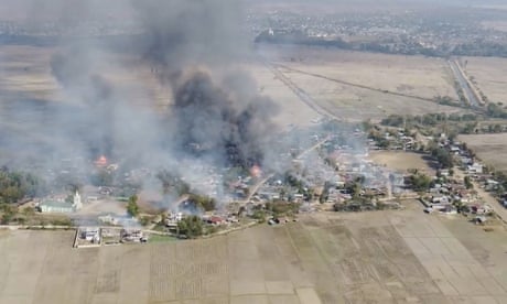 Black smoke arises from burning buildings in Waraisuplia village in Kayah State, Myanmar. The UN says abuses by the junta may amount to war crimes
