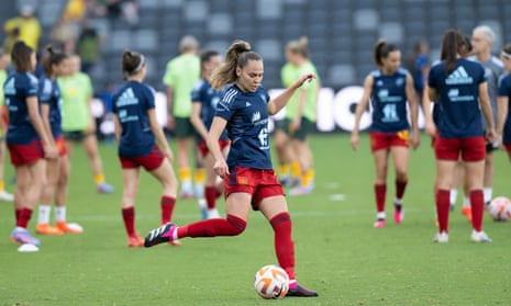 Spain’s players feel the heat during the pre-match warm-up.