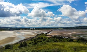 Looking across the causeway from Cramond Island to Cramond on the outskirts of Edinburgh Scotland at low tide