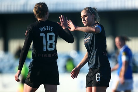 Steph Houghton of Man City celebrates with Ellen White after scoring the team’s third goal.