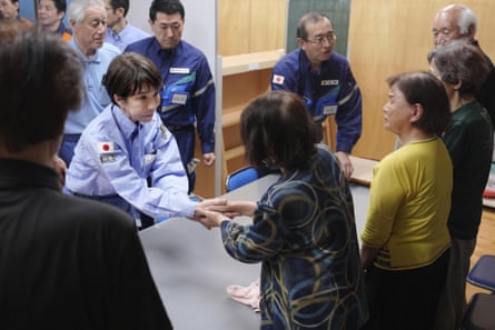 Takaichi greets evacuees in Hikawa.