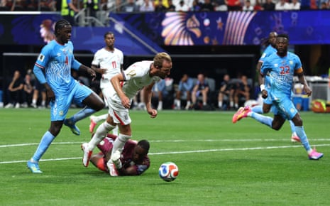 Harry Kane goes down after a touch from Lionel Mpasi.