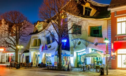 The Crooked House, illuminated shopfront at night, on Bohaterów Monte Cassino, Sopot, Poland