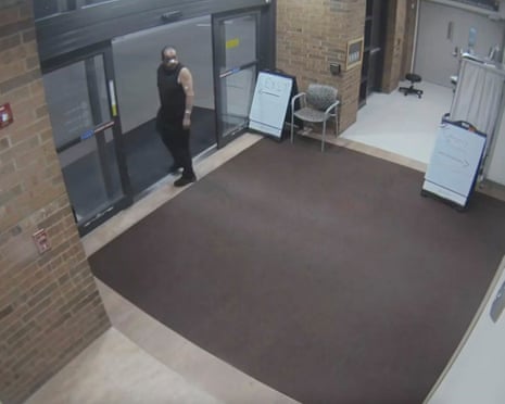 security camera footage shows a man standing at a hospital entrance
