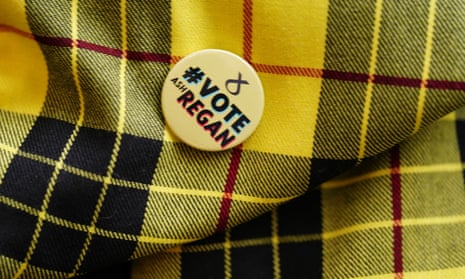 An Ash Regan supporter wears a badge backing the former junior minister as she makes her keynote speech in North Queensferry, Fife, on Friday.