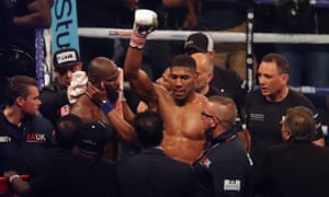Anthony Joshua celebrates his victory over Carlos Takam.
