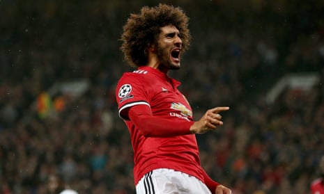 Marouane Fellaini, who came on as a substitute for the injured Paul Pogba, celebrates opening the scoring for Manchester United against Basel at Old Trafford