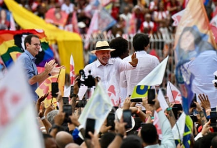 Luiz Inácio Lula da Silva in his trademark panama hat greets supporters at a rally