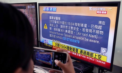 A TV in Taipei shows the alert on screen
