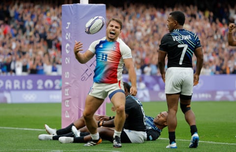 Antoine Dupont celebrates after scoring a try during the men’s rugby sevens gold medal match against Fiji.