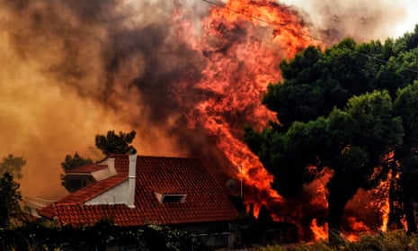 A house in Kineta near Athens is engulfed by flames.