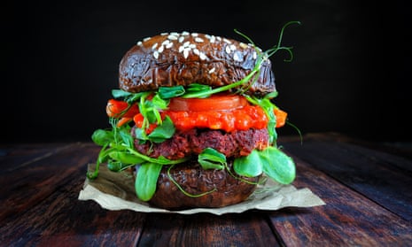 Portobello bun mushroom vegan burger
on a wooden board