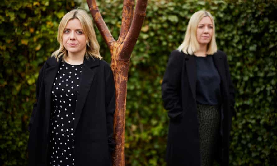 Rebecca Jones and her sister, Jenny Davies, standing by tree.