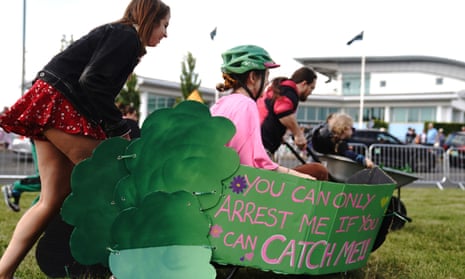 Animal rights protest group Animal Rising in wheelbarrows outside the entrance to the racecourse.