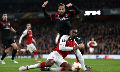 Danny Welbeck wins a penalty for Arsenal against Milan