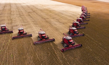 15 combine harvesters gather soyabeans in Campo Verde, Brazil.