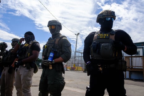 Federal agents stand guard outside Delaney Hall