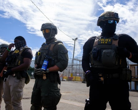 Federal agents stand guard outside Delaney Hall.