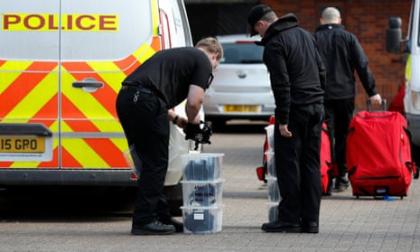 Police officers prepare equipment as OPCW inspectors arrive in Salisbury.