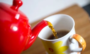 Tea being poured into cup