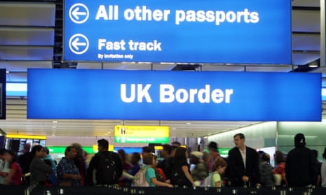 Passengers going through the UK border at Terminal 2 of Heathrow airport. 