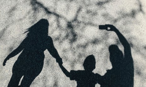 Shadow of a family taking a selfie