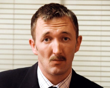 Portrait of man with moustache in suit