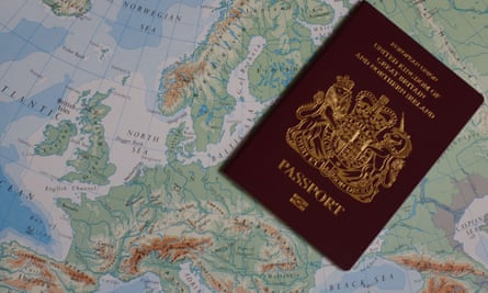 Photo of a United Kingdom of Great Britain and Northern Ireland passport against a map of Europe.