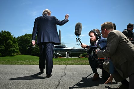 President Trump waves after speaking to the press at the White House