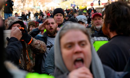 A pro-gun activist shouts at a small group of anti-white supremacy protesters at a rally by gun supporters outside the Virginia state Capitol grounds in January.