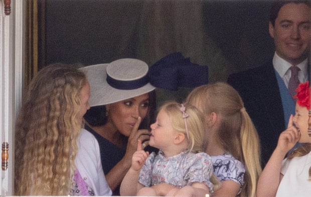 Meghan Markle with Savannah Phillips and Mia Tindall in the Major General’s office overlooking the trooping the colour on Horse Guards Parade.