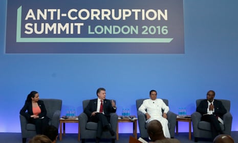 Laura Stefan, the anti corruption coordinator for the Romanian Academic Society, Colombian President Juan Manuel Santos, Sri Lankan President Maithripala Sirisena and business man Strive Masiyiwa take part in a panel discussion at the Anti-Corruption Summit held at Lancaster House