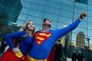 Cosplayers Supergirl and Superman