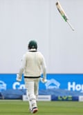 Australia’s Usman Khawaja launches his bat after scoring a century against England