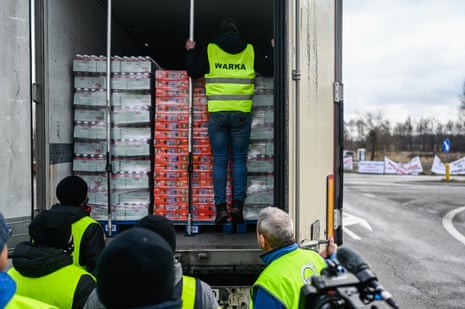Polish farmers inspect a Ukrainian truck that wishes to pass during the ongoing blockade by Polish farmers at the Polish-Ukrainian border in Dorohusk, Poland on Wednesday.