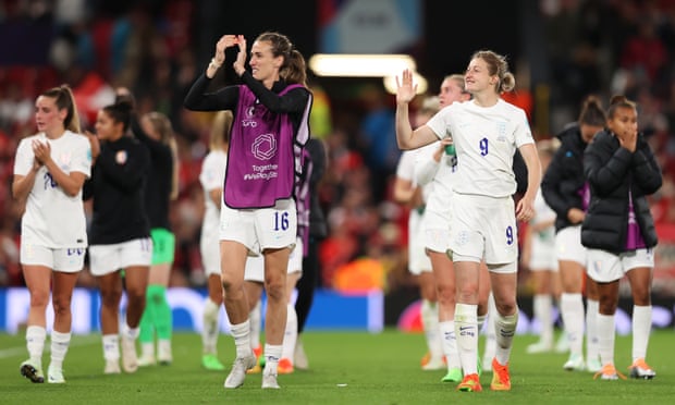 Jill Scott and Ellen White applaud the fans at Old Trafford after England’s win against Austria.