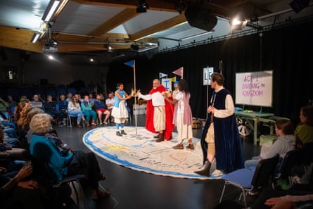 The audience to the play watch from three sides in intimate production.