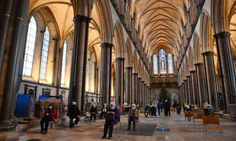 People rest in Salisbury Cathedral, England, after receiving the Pfizer/BioNTech vaccine.
