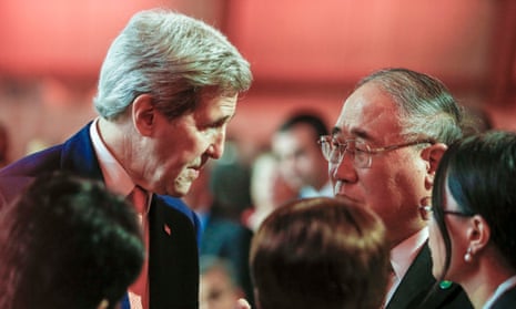 John Kerry talks with China’s special representative on climate change Xie Zhenhua during the COP21 talks north of Paris.